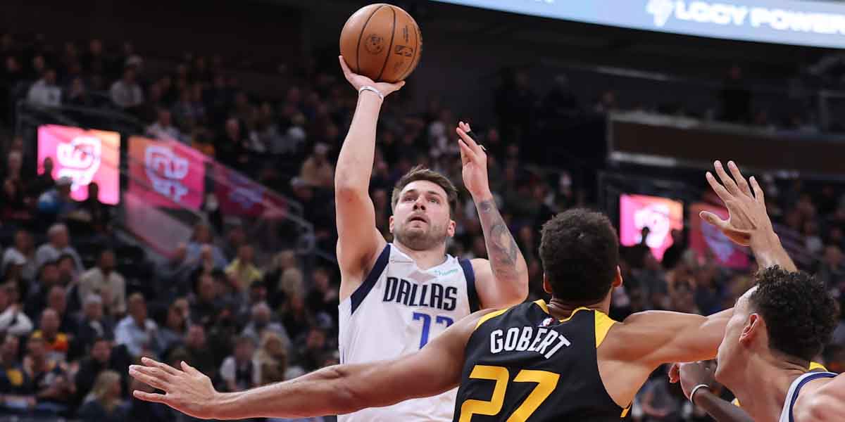 Luka Doncic prova il tiro contro la difesa di Rudy Gobert