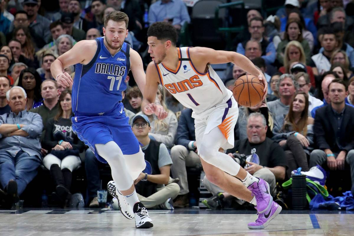 Luka Doncic in difesa su Devin Booker